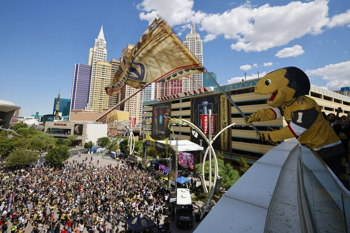Golden Knights mascot Chance flies a flag as DJ Steve Aoki performs outside T-Mobile Arena, Tue ...