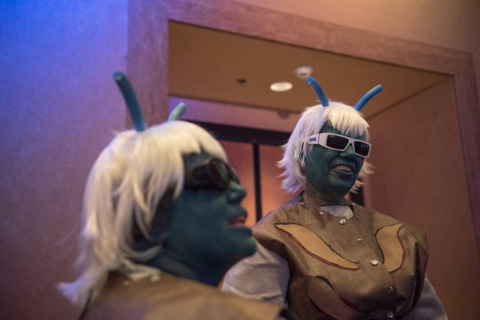 T.K. Agin, left, with her mother, Jodi Agin-Batten, wait in line for a photo op with George Tak ...