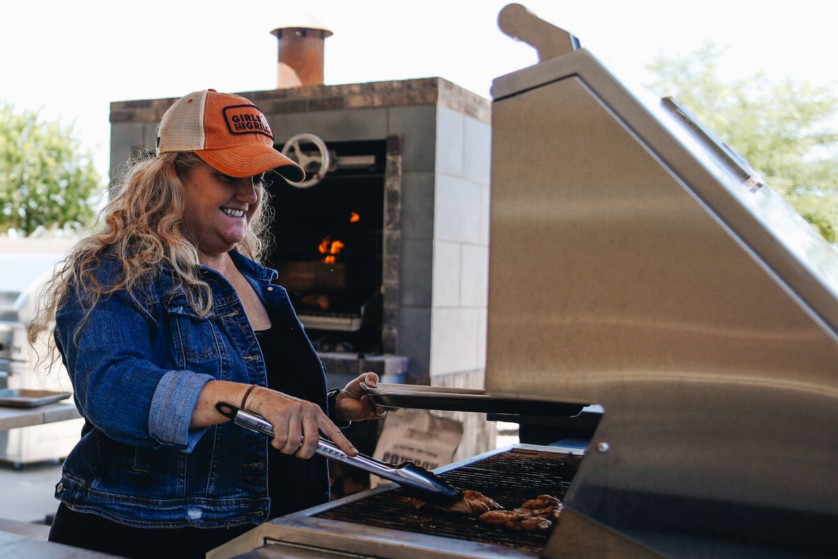 Christie Vanover grills chicken on Friday, June 30, 2023, in her backyard in Henderson. (Madeli ...