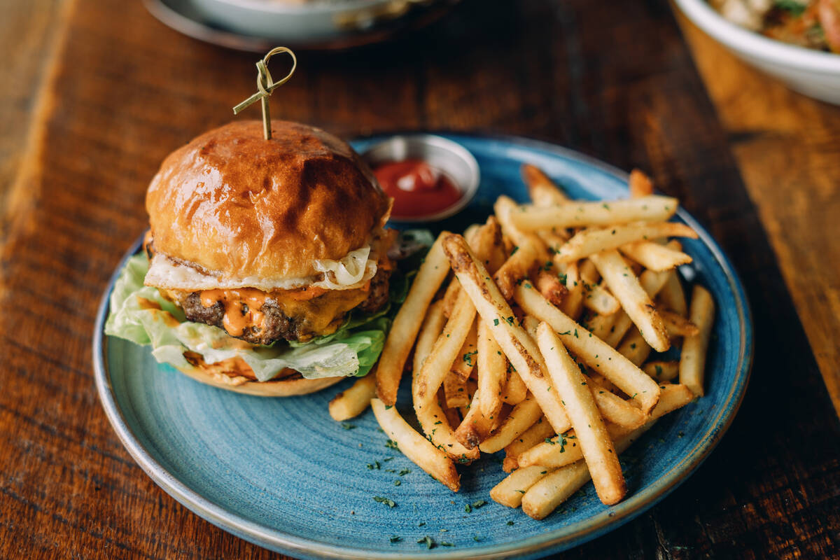 A chipotle burger from Eureka! restaurant in downtown Las Vegas is built with a Havarti-crusted ...