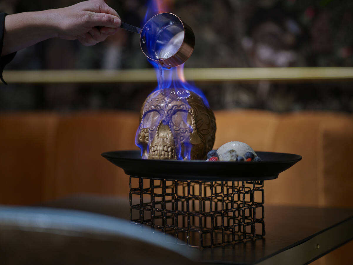 Blue fire engulfs the Flaming Skull dessert at Chica restaurant in The Venetian on the Las Vega ...