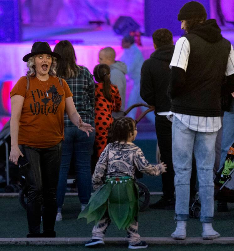Beth Dais, left, scares her grandson Tyson Dais, 3, center, during the Haunted Harvest Hallowee ...