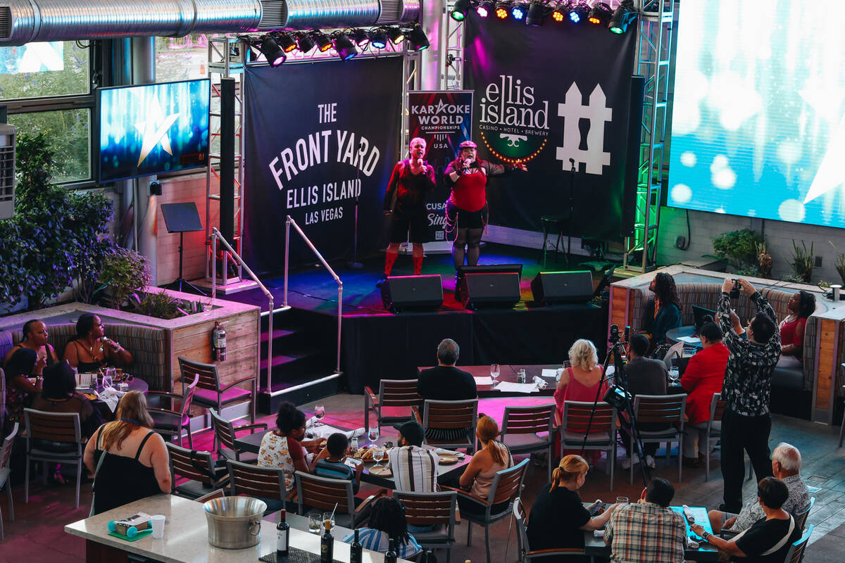 A duo performs during the Karaoke World Championships at Ellis Island casino on Saturday, July ...