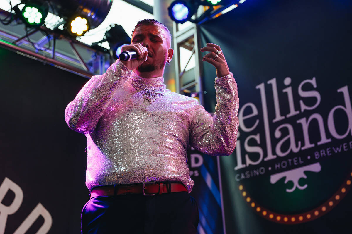 Nate Love performs “Hometown Glory” by Adele during the solo round at the Karaoke ...