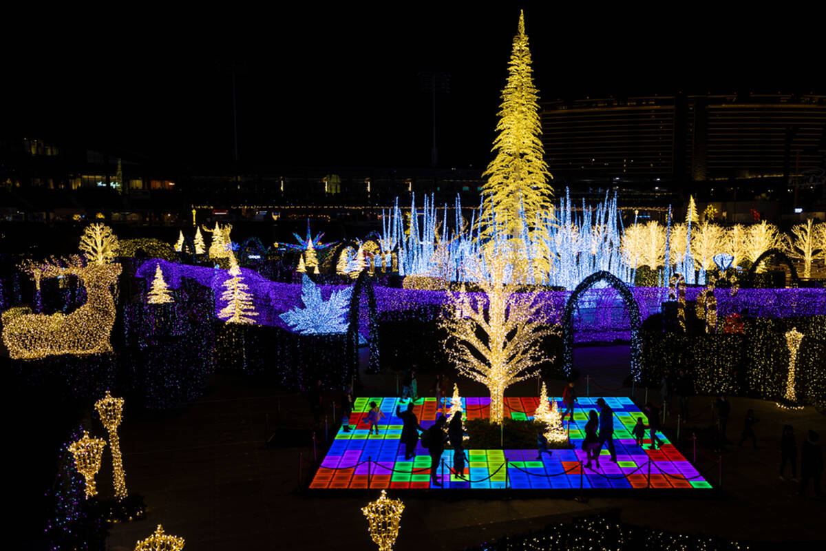 Attendees explore Enchant Christmas at Las Vegas Ballpark on Tuesday, Nov. 30, 2021, in Las Veg ...