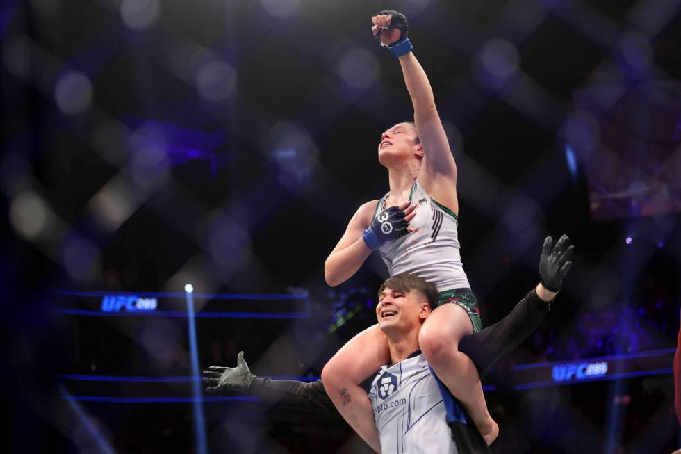 Alexa Grasso celebrates her fourth round submission victory against Valentina Shevchenko in a w ...