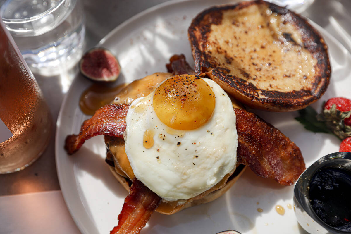 The Breakfast Burger, featuring custom beef grind, cheese and bacon on a French toast bun, with ...