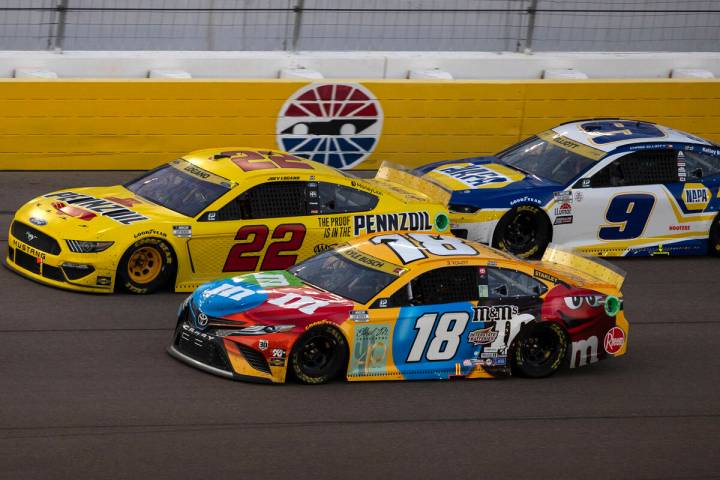 Kyle Busch (18) Joey Logano (22) and Chase Elliot (9) race during the 4th Annual South Point 40 ...