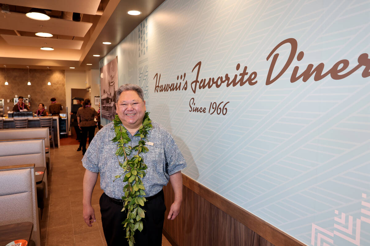CEO Jason Higa, whose family founded Zippy’s in 1966, poses before for the grand opening ...