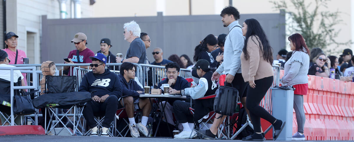 People wait near the front of the line for the grand opening of Zippy’s at the corner of ...