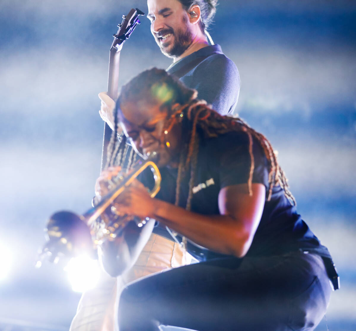 Arnetta Johnson, trumpeter for AJR, and Adam Met, bass player for AJR, perform at the 2023 SEMA ...