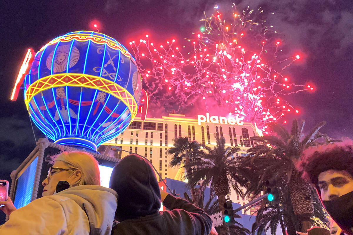 Fireworks explode over the Las Vegas Strip during New Year's celebrations, Friday, Dec. 31, 202 ...