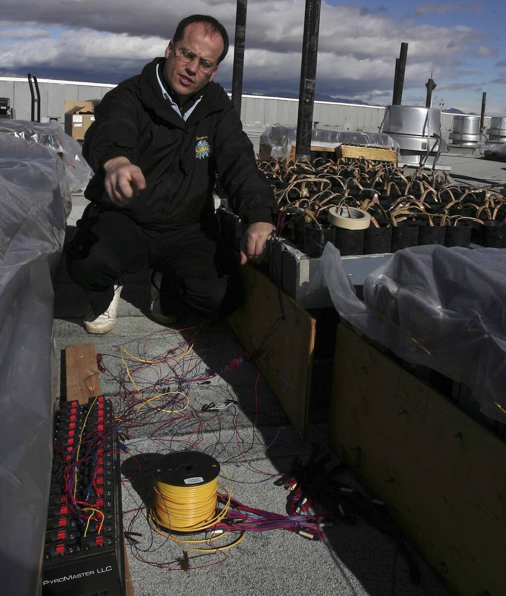 Phil Grucci explains the setup on top of TI for the fireworks show for New Year's Eve in this f ...