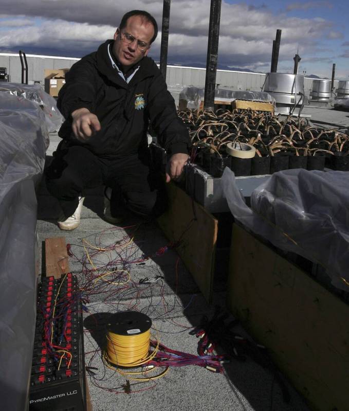 Phil Grucci explains the setup on top of TI for the fireworks show for New Year's Eve in this f ...