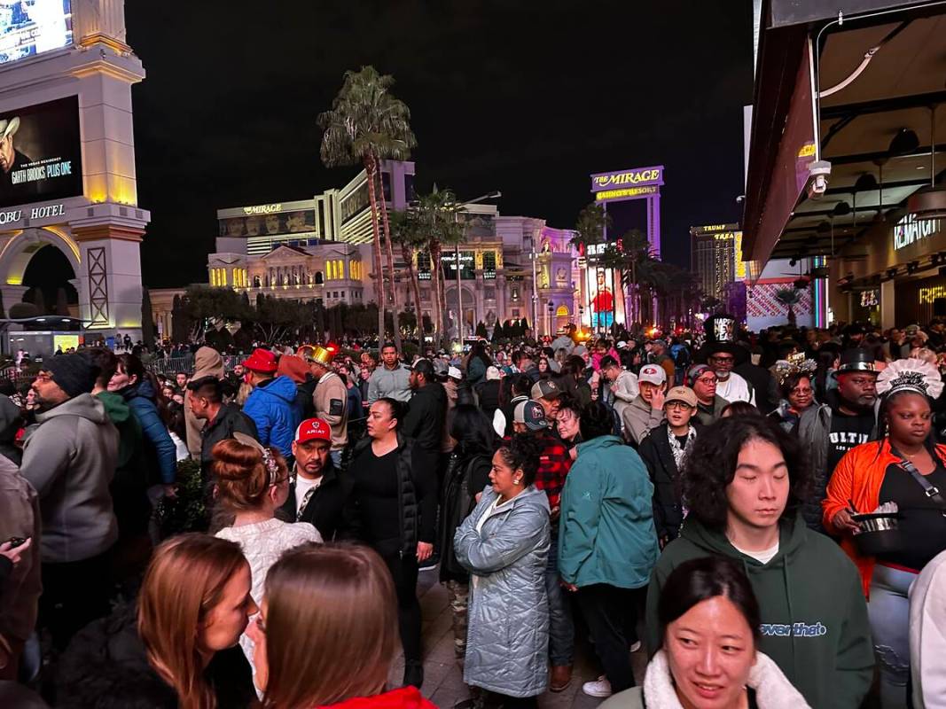 Very crowded in front of Caesars Palace and the Linq to the point people are walking shoulder t ...