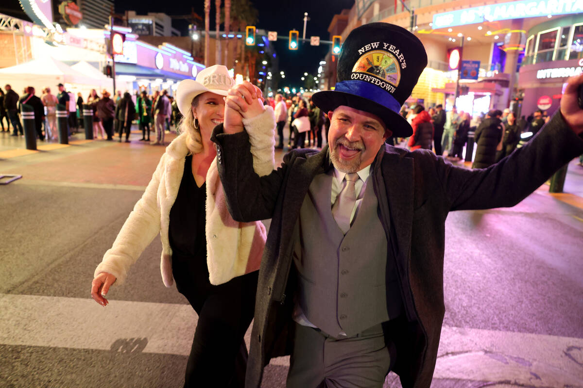 New Year’s Eve newlyweds Travis and Teresa Carmicheal of Redding, Calif. celebrate durin ...