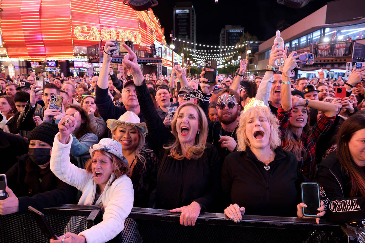 New Year’s Eve revelers, including from left, Elizabeth Martinez of Las Vegas, Donna Smi ...