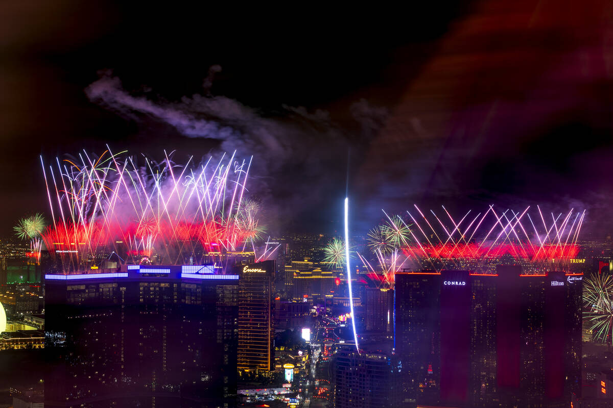 Fireworks erupt over the Las Vegas Strip as part of New Years Eve festivities across the city f ...
