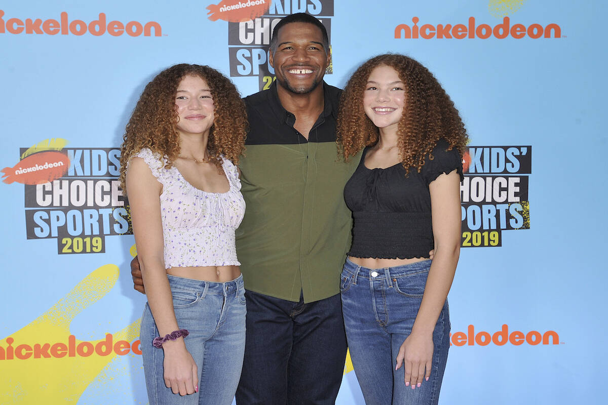Michael Strahan, center, and his daughters Sophia Strahan, left, and Isabella Strahan arrive at ...
