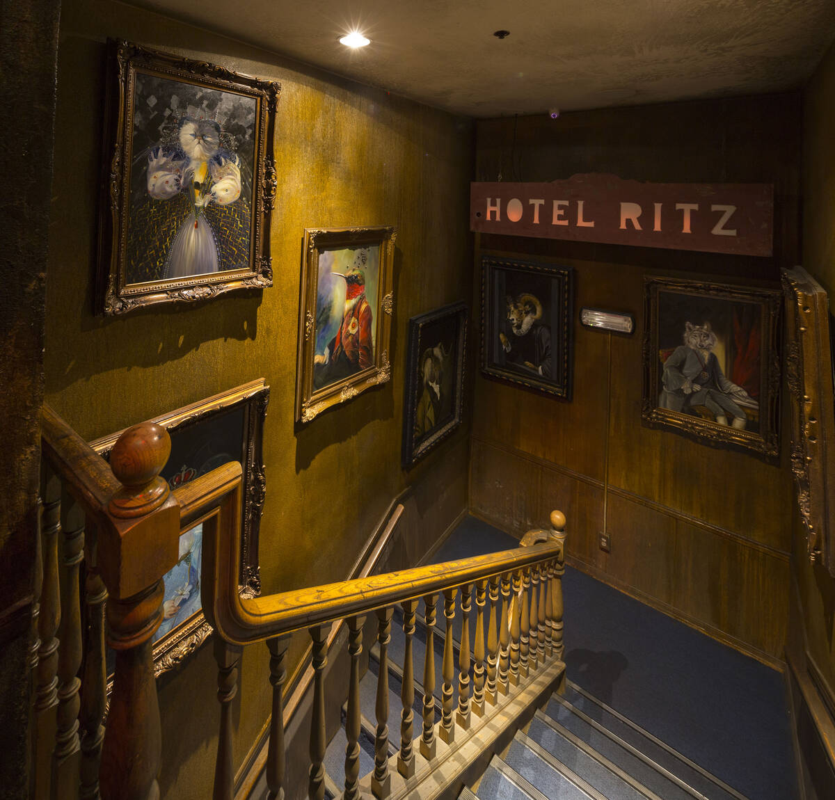 A collection of artwork hangs in a stairwell at Zak Bagans’ The Haunted Museum located at ...