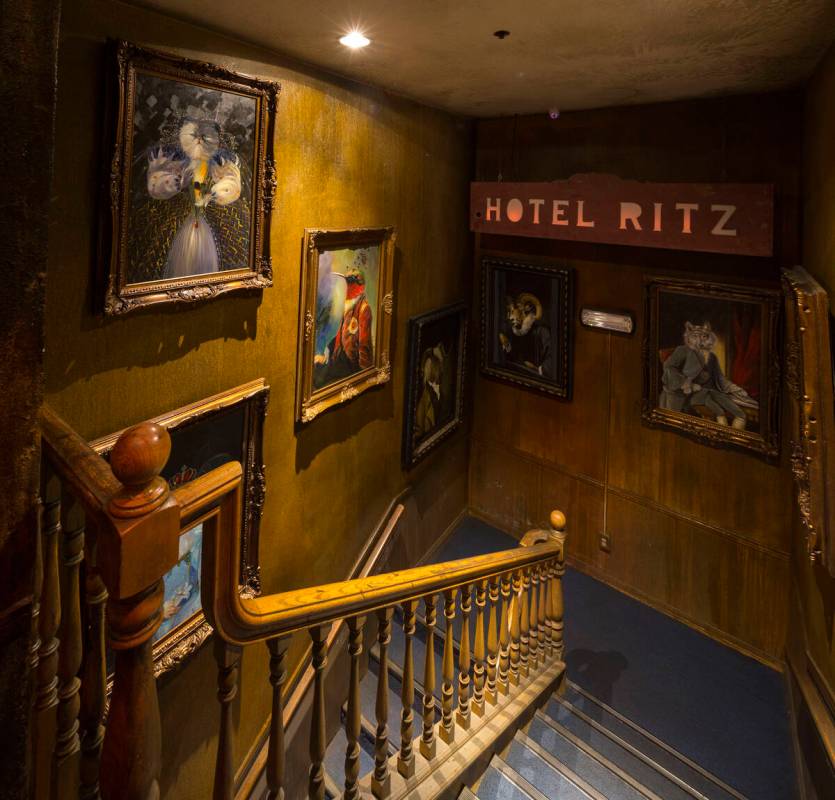 A collection of artwork hangs in a stairwell at Zak Bagans’ The Haunted Museum located at ...