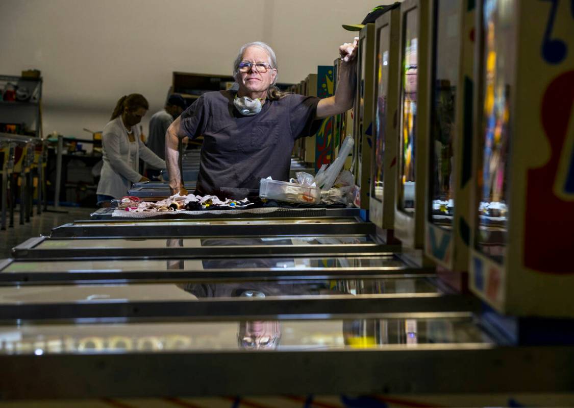Pinball Hall of Fame owner Tim Arnold still repairs his machines at the new location across fro ...