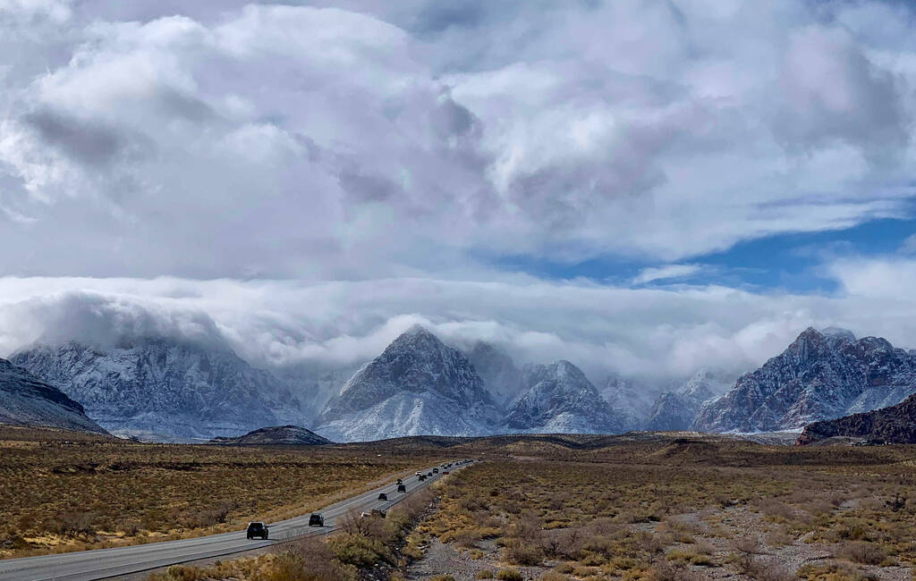State Route 159 and snow covered mountains at Red Rock Canyon on Monday, Jan. 25, 2021, in Las ...