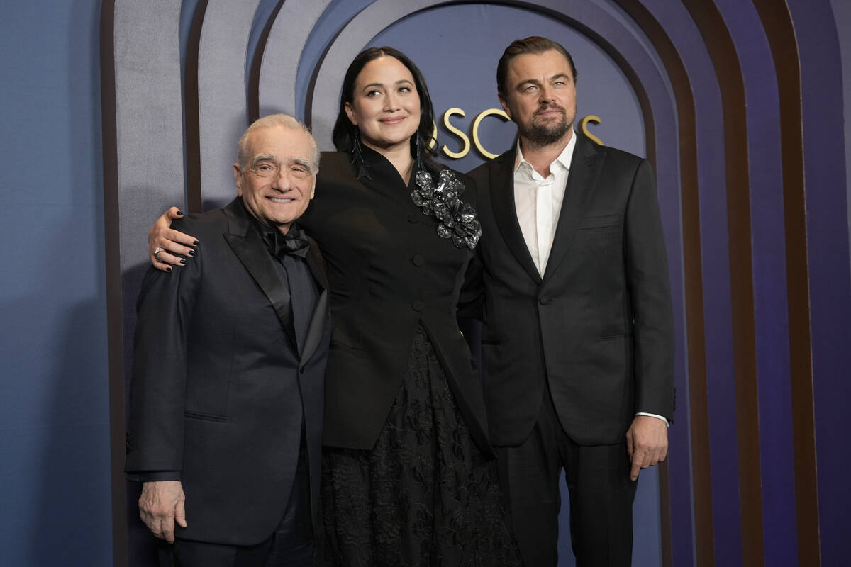 Martin Scorsese, from left, Lily Gladstone, and Leonardo DiCaprio arrive at the Governors Award ...