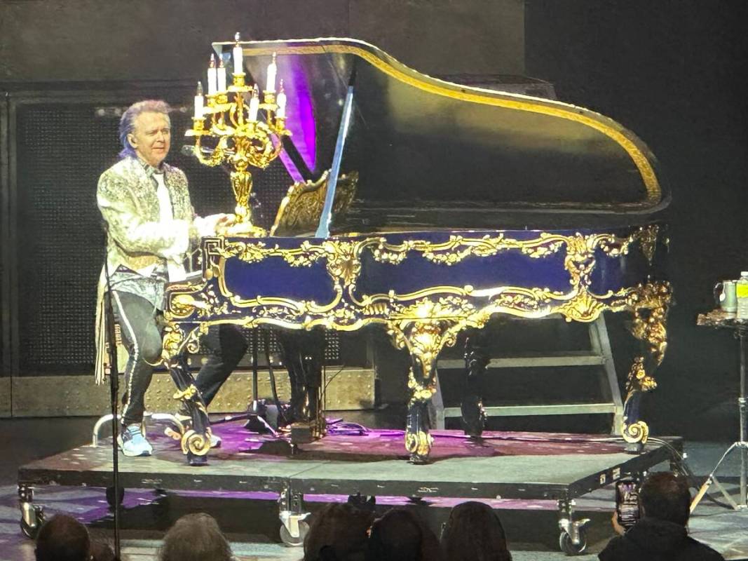 Lawrence Gowan of Styx is shown with Liberace's "Dancing Waters" Liberace Steinway at The Venet ...