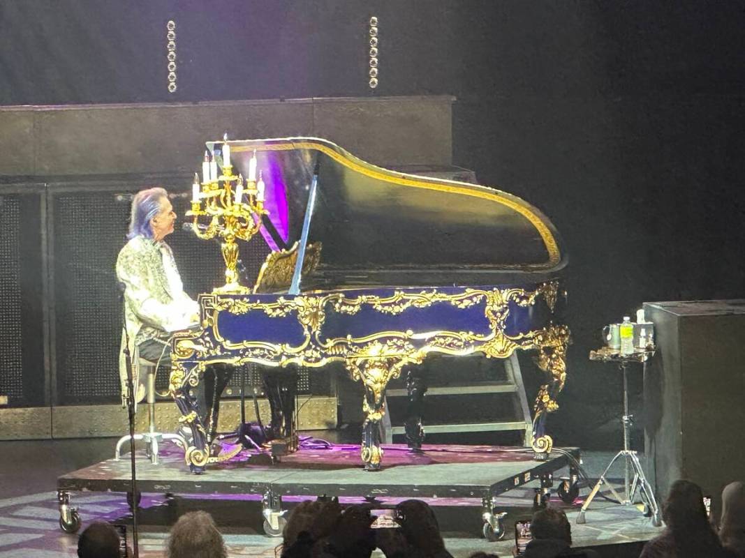 Lawrence Gowan of Styx is shown with Liberace's "Dancing Waters" Liberace Steinway at The Venet ...