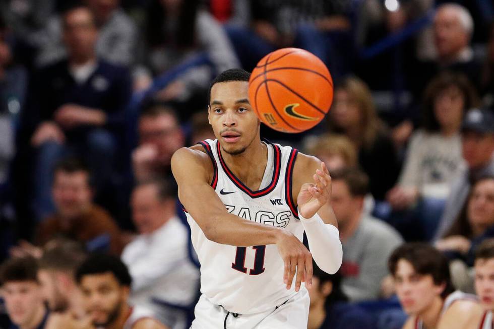 Gonzaga guard Nolan Hickman passes the ball during the second half of an NCAA college basketbal ...