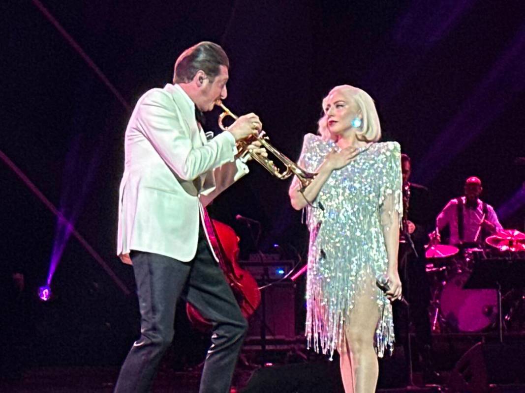 Brian Newman and Lady Gaga are shown at "The Dinner Show" Super Bowl party hosted by Mark Davis ...