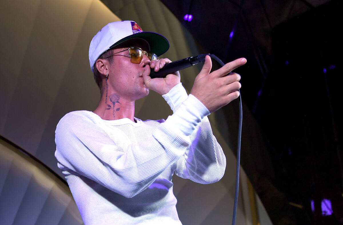 Justin Bieber performs onstage during h.wood Group's grand opening of Delilah at Wynn Las Vega ...