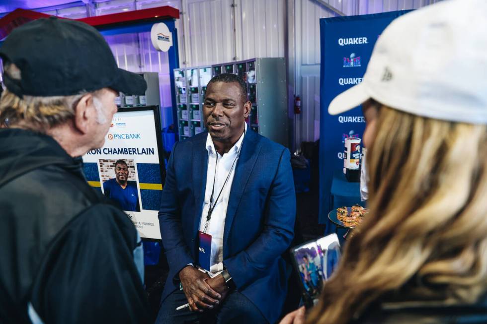 Former NFL tight end Byron Chamberlain speaks to football fans at the Taste of NFL event at the ...