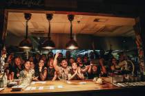 The staff at Esther’s Kitchen pose for photographs on the last night of service before moving ...