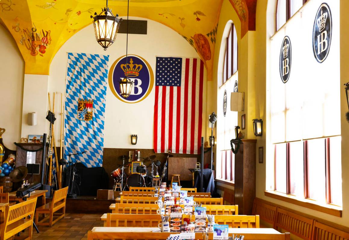 A giant Bavarian flag, left, and U.S. flag are displayed at Hofbräuhaus Las Vegas, on Thur ...