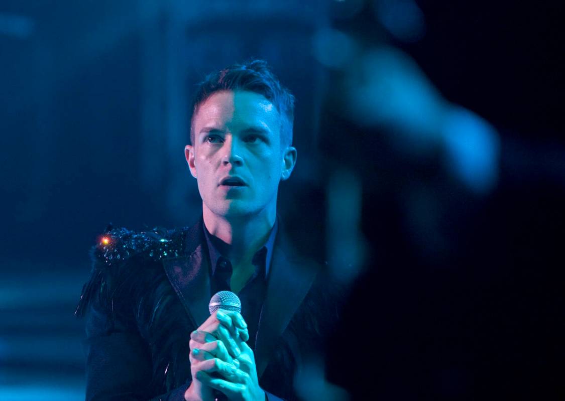 Brandon Flowers of The Killers performs with the band to a sold-out crowd during the opening ni ...