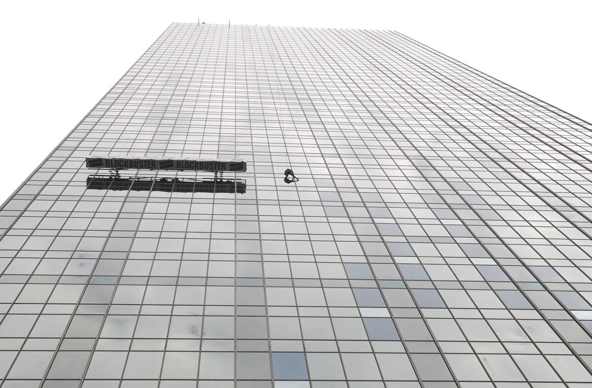 Las Vegas stuntman and character actor Rich Hopkins, shown here scaling a skyscraper during a d ...