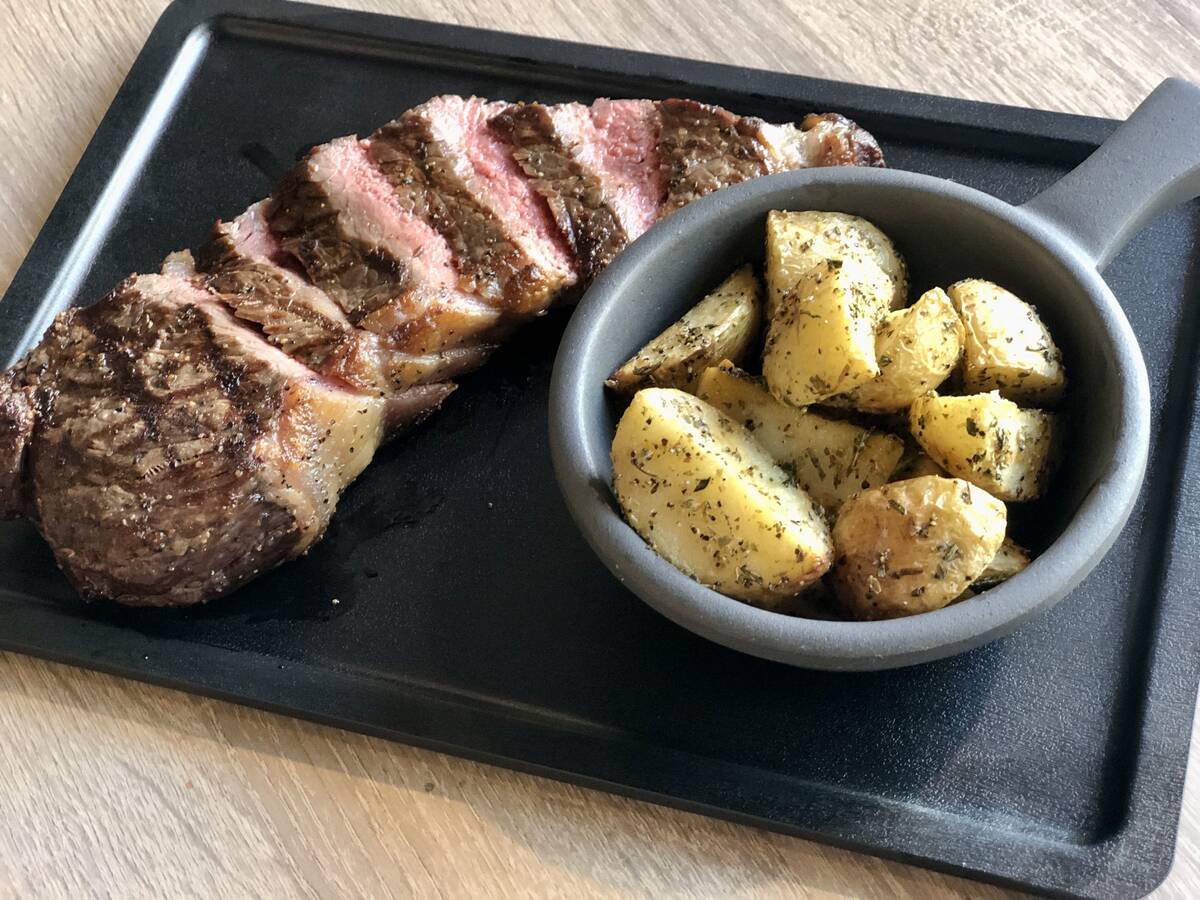 A New York steak with herb roasted potatoes from Crash N Burn in downtown Las Vegas. (Johnathan ...