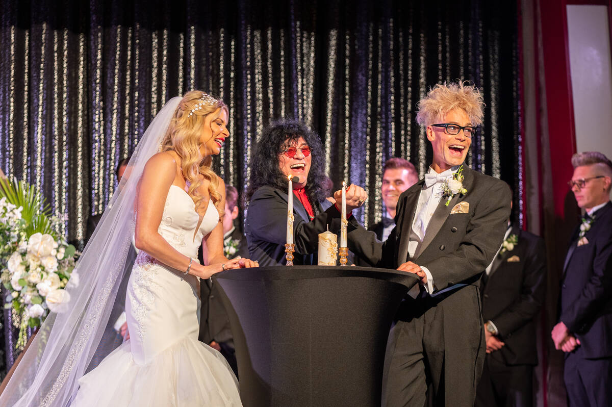 Dani Elizabeth, left, and Murray Sawchuck, right, with officiant Paul Shortino, are shown on th ...