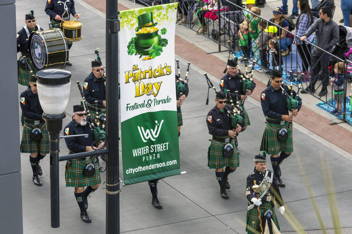 Members of the Las Vegas Emerald Society Pipes and Drums Band play in the parade down Water Str ...