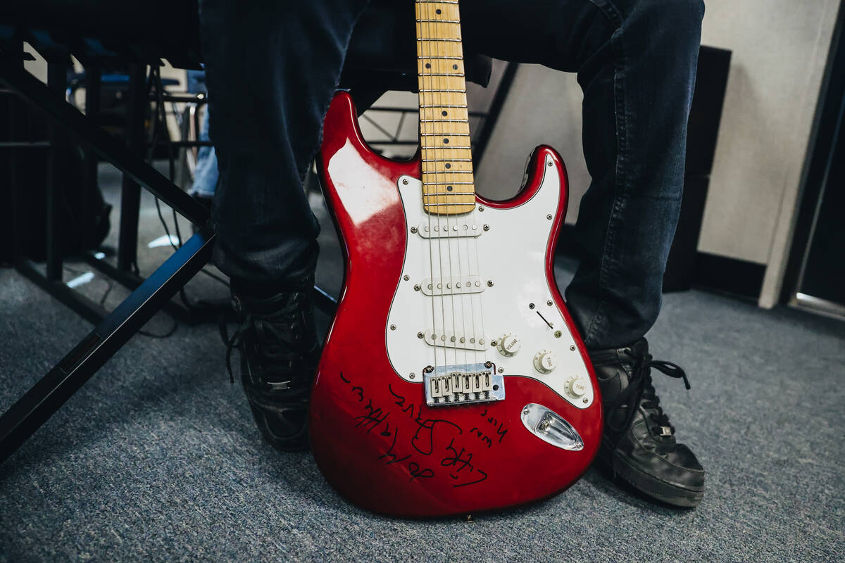 Matthew Yawson, 16, sits with his guitar between his legs after Stevie Van Zandt, a guitarist a ...