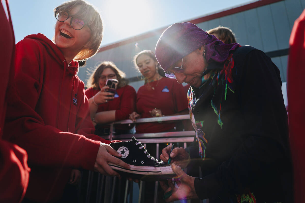 A student smiles as Stevie Van Zandt, a guitarist and member of Bruce Springsteen’s E St ...