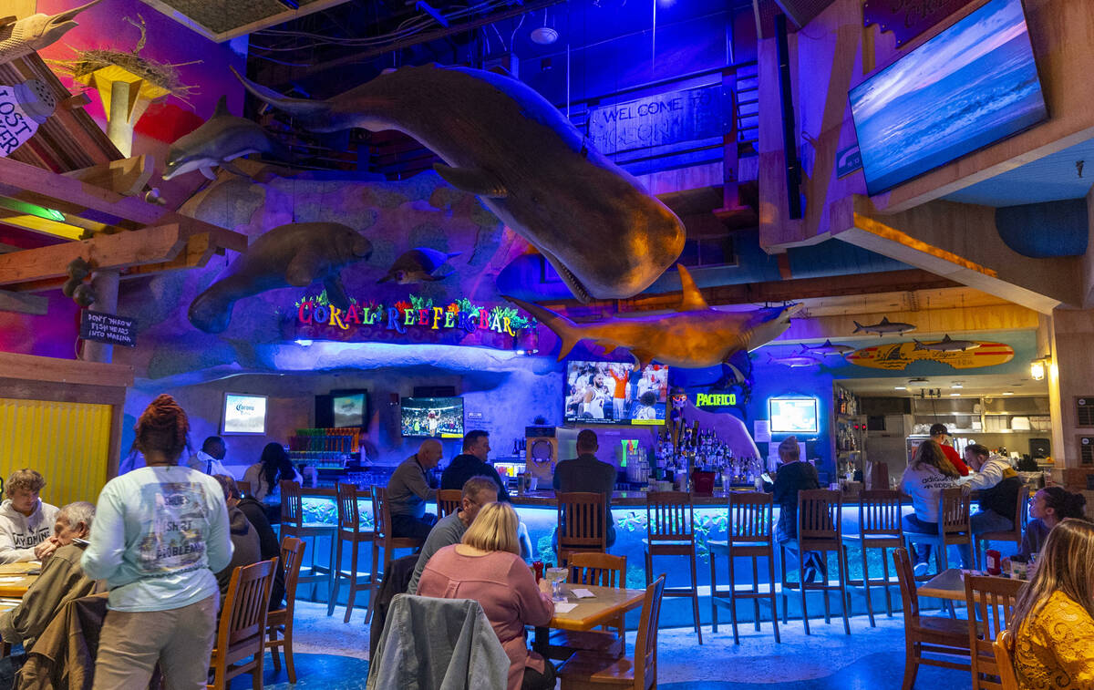 Guests dine and drink at a bar within Margaritaville off the Strip on Friday, March 15, 2024, i ...
