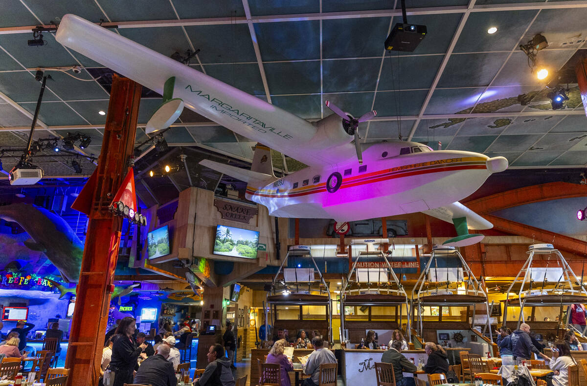 Guests dine and drink at a bar within Margaritaville off the Strip on Friday, March 15, 2024, i ...