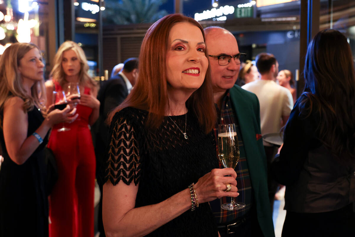 Guests enter Emmitt’s Vegas during its opening night party in Fashion Show mall on Thurs ...