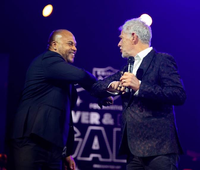 Raiders coach Antonio Pierce, left, and recording superstar David Foster are shown at the inaug ...