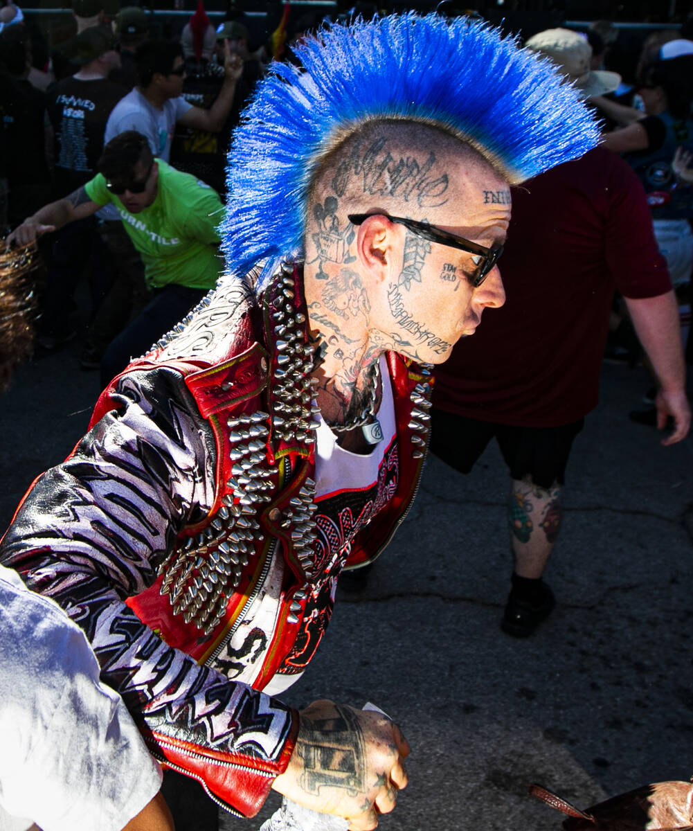 Attendees mosh in a circle pit during the Punk Rock Bowling music festival on Saturday, May 27, ...