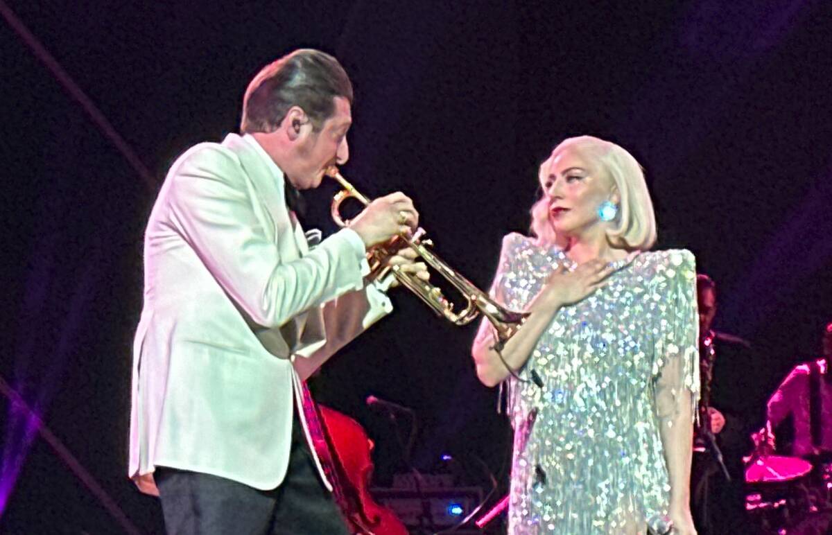 Brian Newman and Lady Gaga are shown at "The Dinner Show" Super Bowl party hosted by Mark Davis ...