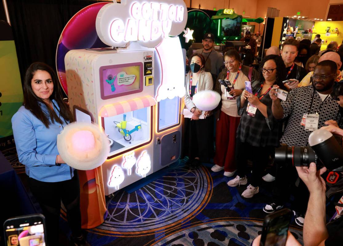Arousha Ashegh, vice president of sales at Sweet Robo, shows cotton candy created by a fully au ...